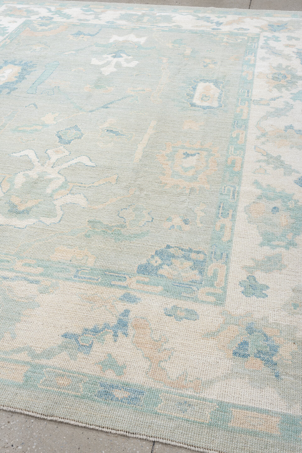 8' x 10' one-of-a-kind handmade vintage Oushak large size rug. Color palette: pale aqua, ivory, sky blue, taupe, cream, sage