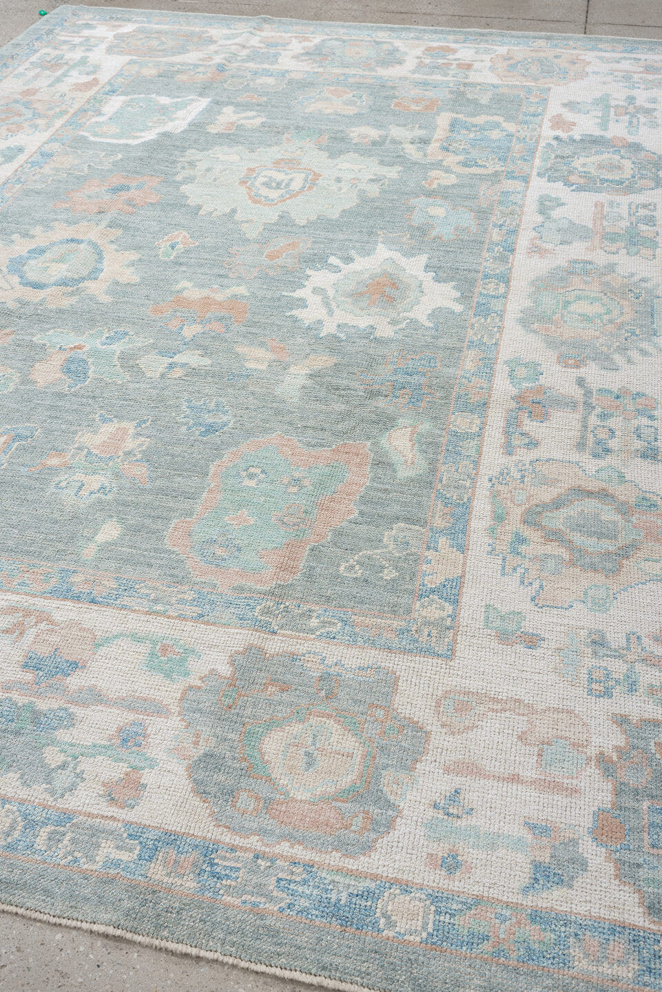 7' x 10' one-of-a-kind handmade vintage Oushak large size rug. Color palette: pale blue, ivory, sage, blush, taupe