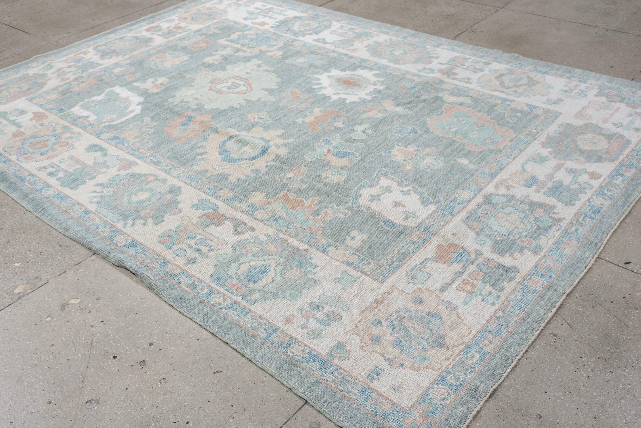 7' x 10' one-of-a-kind handmade vintage Oushak large size rug. Color palette: pale blue, ivory, sage, blush, taupe