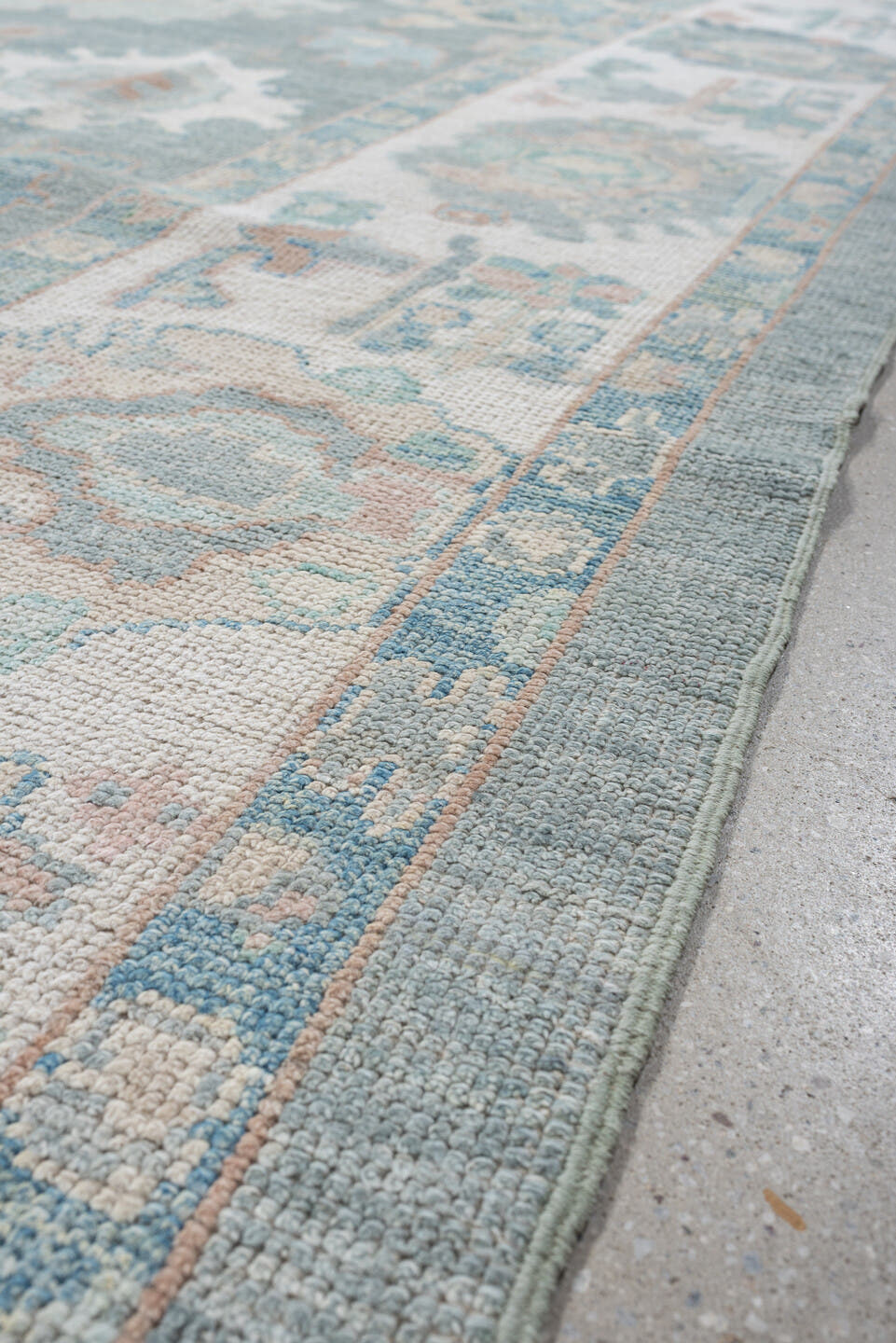 7' x 10' one-of-a-kind handmade vintage Oushak large size rug. Color palette: pale blue, ivory, sage, blush, taupe