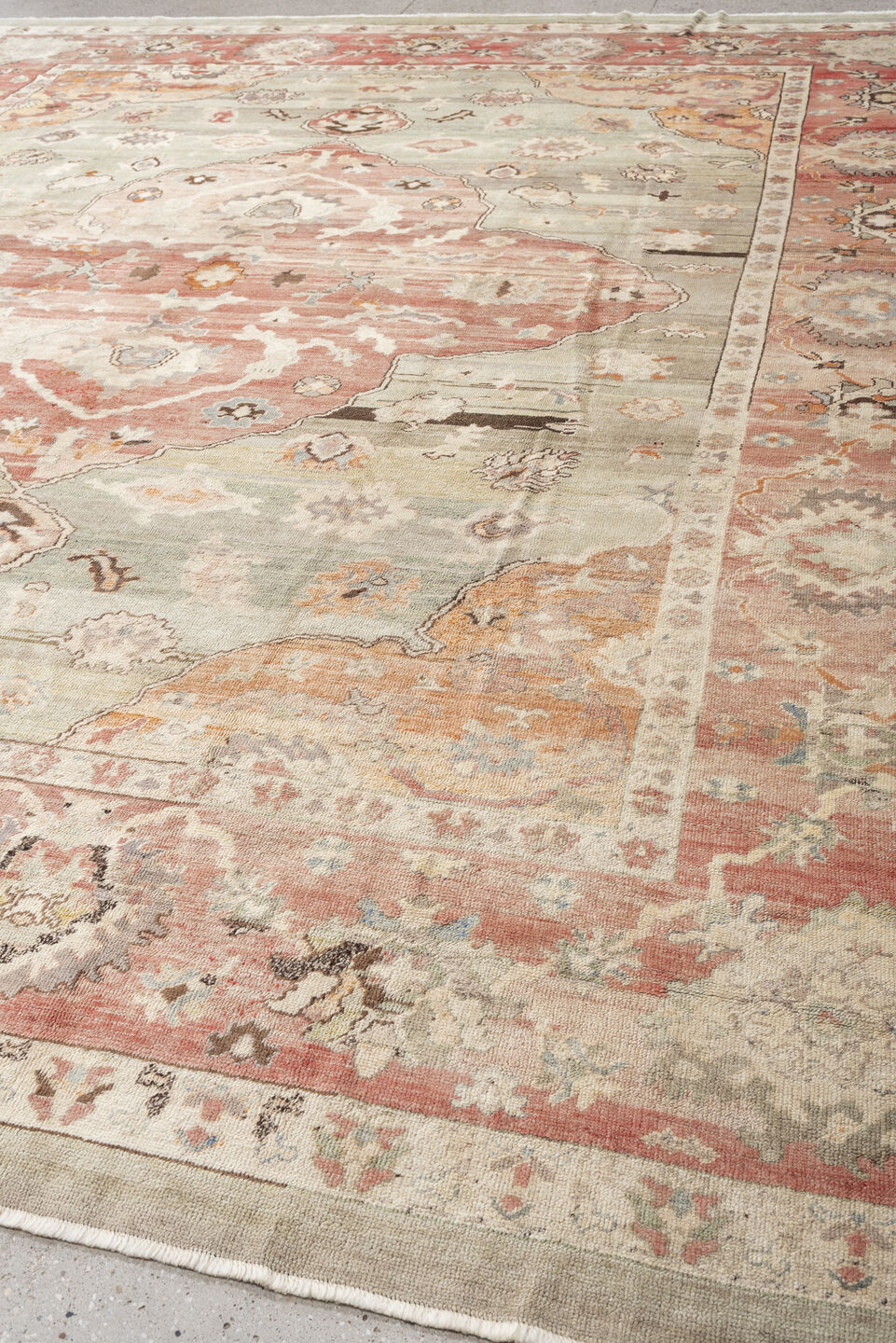 12' x 14' one-of-a-kind handmade vintage Oushak oversize rug. Color palette: sage, coral, ivory, terracotta, taupe, peach