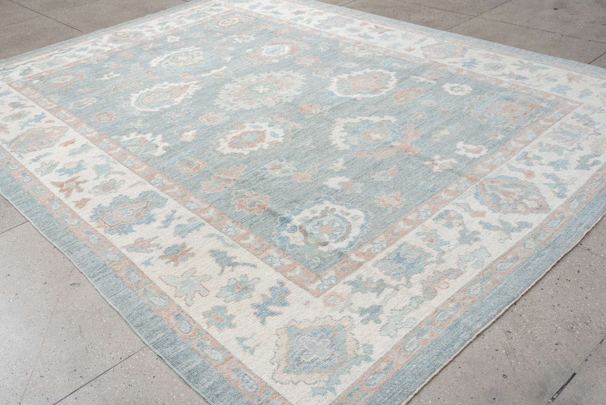 9' x 12' one-of-a-kind handmade vintage Oushak large size rug. Color palette: pale blue, ivory, blush, sage, peach, taupe