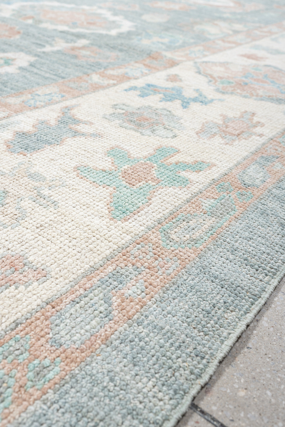 9' x 12' one-of-a-kind handmade vintage Oushak large size rug. Color palette: pale blue, ivory, blush, sage, peach, taupe