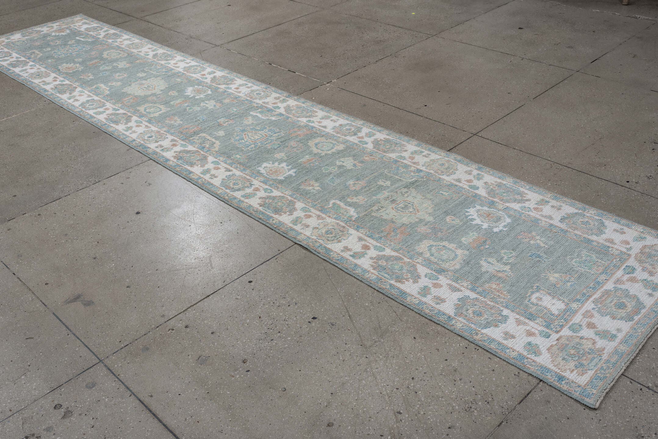 2' x 14' one-of-a-kind handmade vintage Oushak runner rug. Color palette: light blue, ivory, taupe, sage, peach, beige, gray