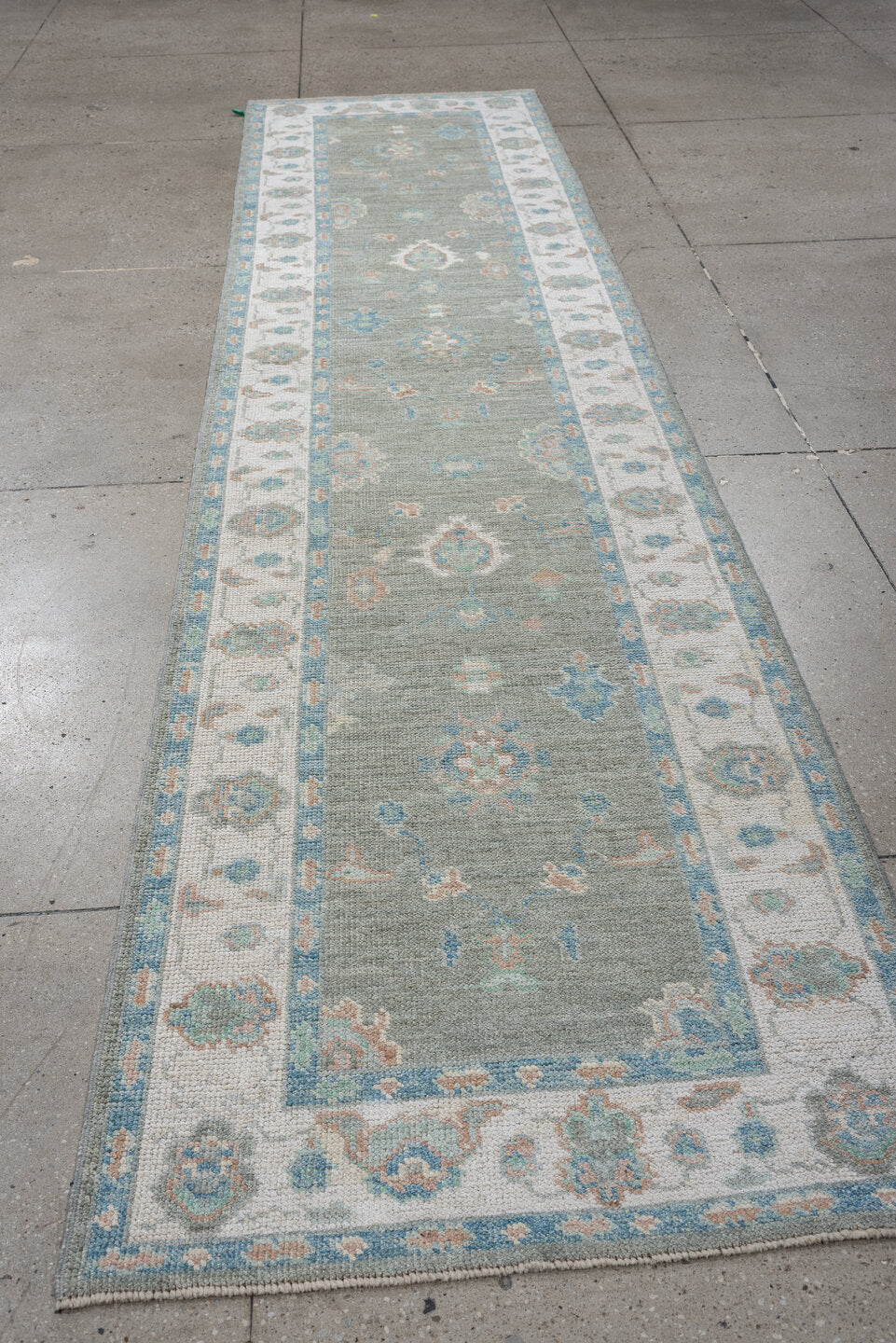 3' x 12' one-of-a-kind handmade vintage Oushak runner rug. Color palette: sage, ivory, aqua, blush, taupe, cream, green