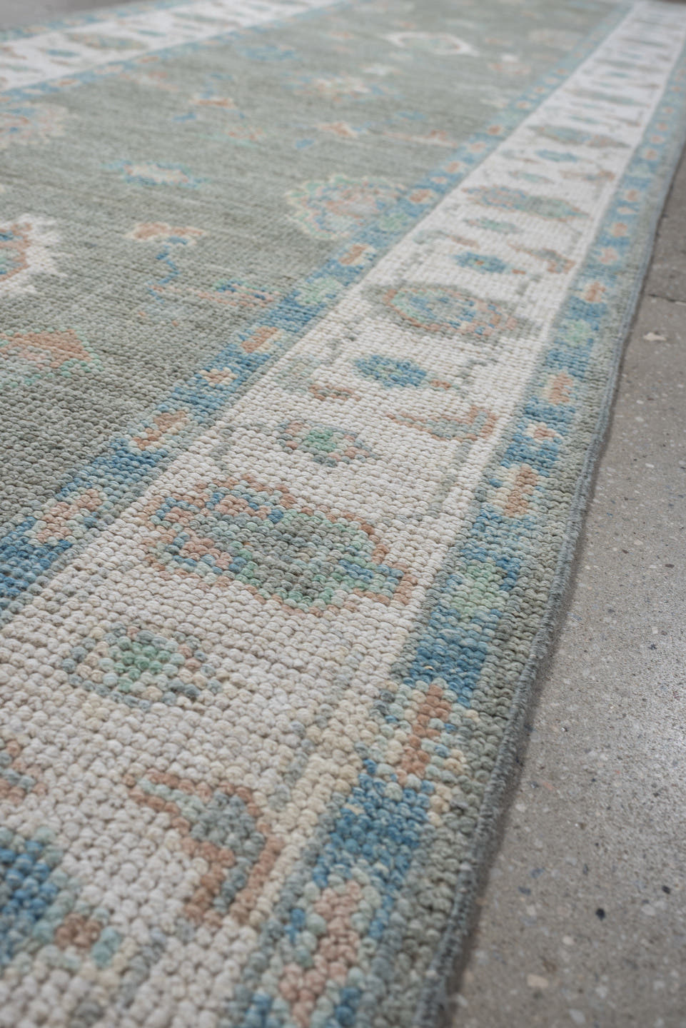 3' x 12' one-of-a-kind handmade vintage Oushak runner rug. Color palette: sage, ivory, aqua, blush, taupe, cream, green