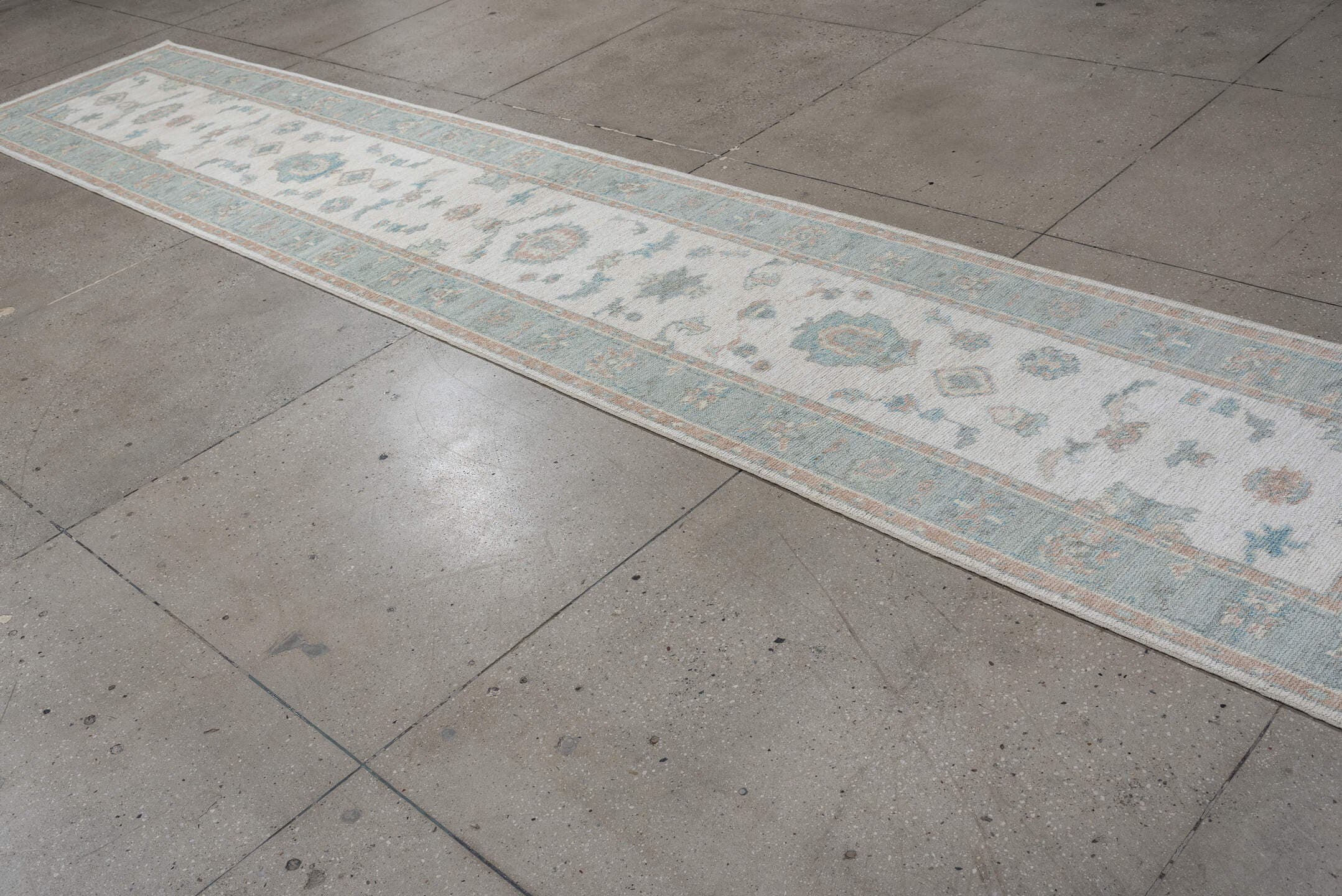 3' x 15' one-of-a-kind handmade vintage Oushak runner rug. Color palette: ivory, pale aqua, blush, taupe, sage, teal, pink