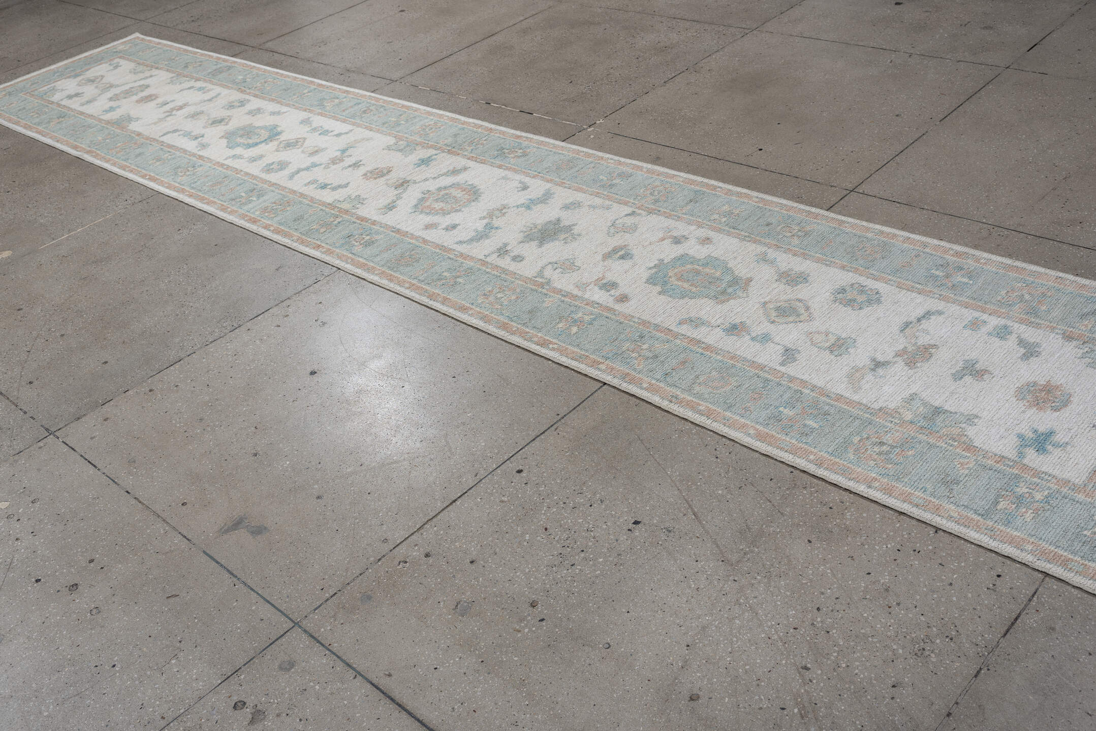 3' x 15' one-of-a-kind handmade vintage Oushak runner rug. Color palette: ivory, pale aqua, blush, taupe, sage, teal, pink