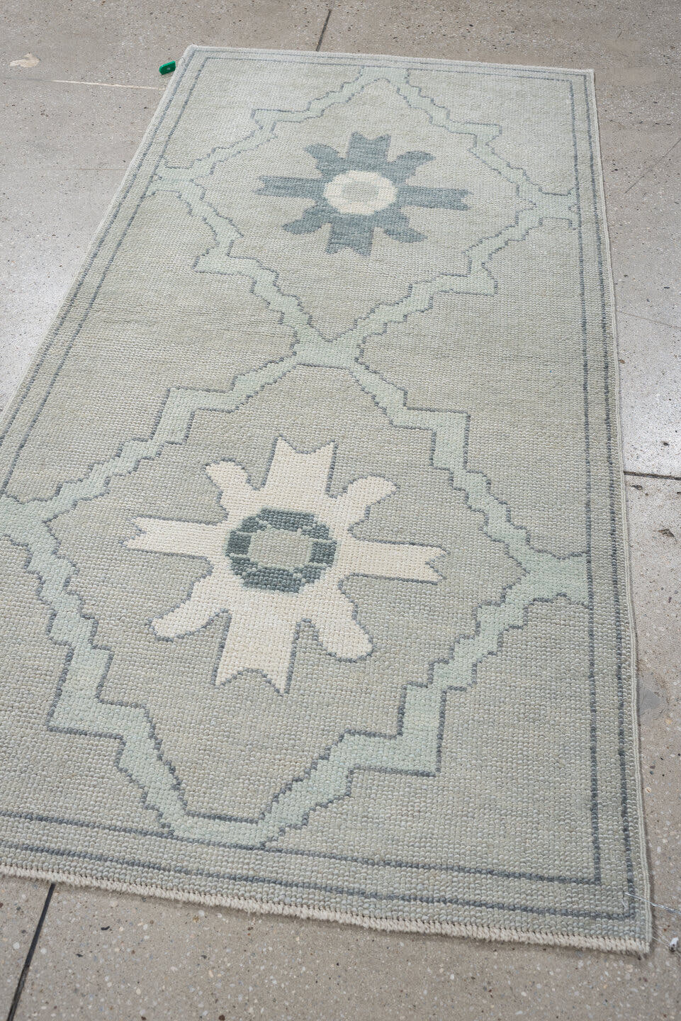 3' x 6' one-of-a-kind handmade vintage Oushak runner rug. Color palette: ivory, light blue, pale gray, cream, light gray