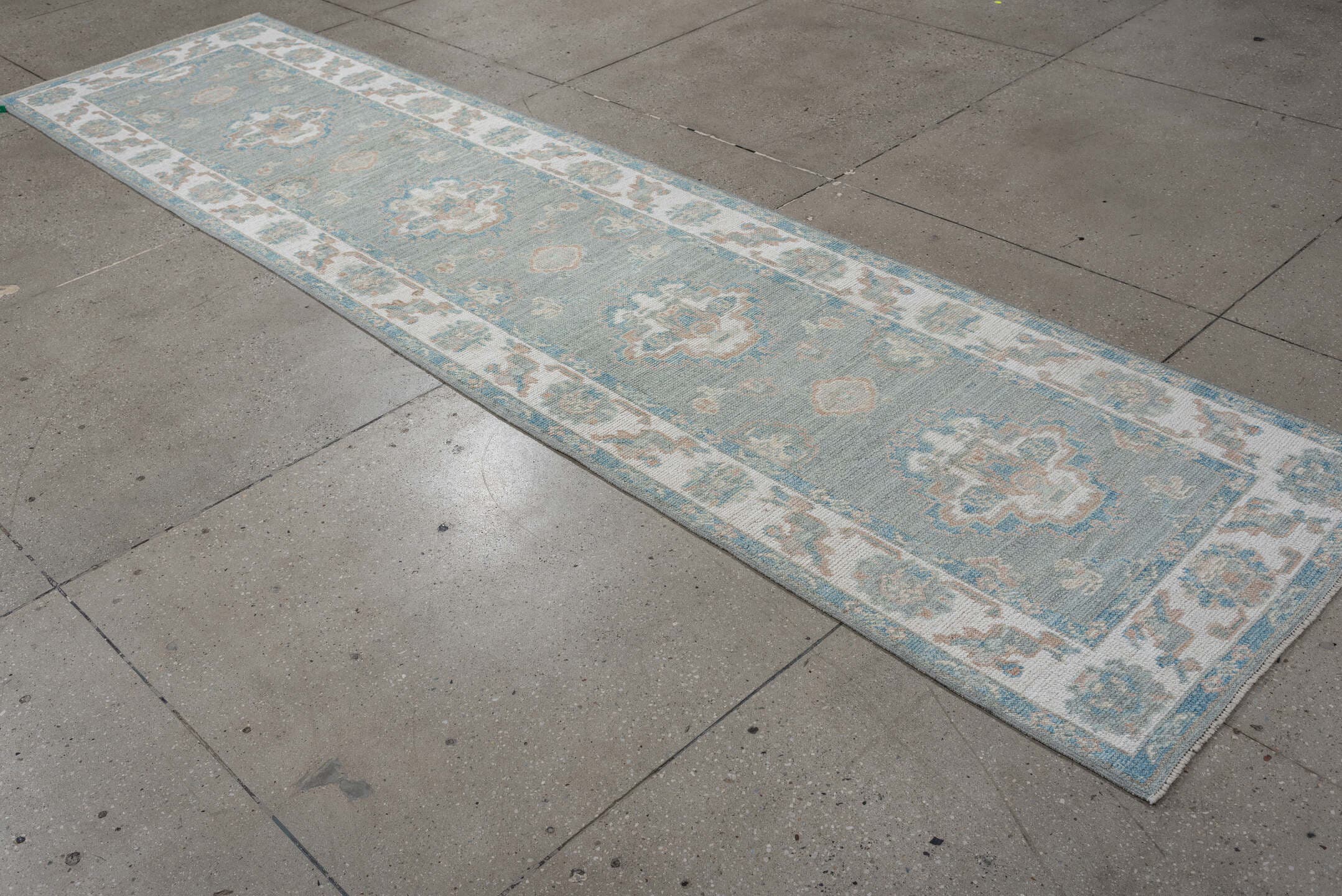 3' x 12' one-of-a-kind handmade vintage Oushak runner rug. Color palette: sky blue, ivory, beige, taupe, sage, light blue