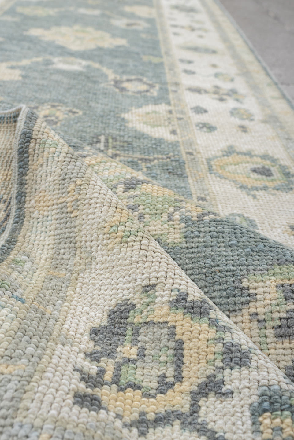 3' x 9' one-of-a-kind handmade vintage Oushak runner rug. Color palette: pale blue, ivory, sage, taupe, slate, cream