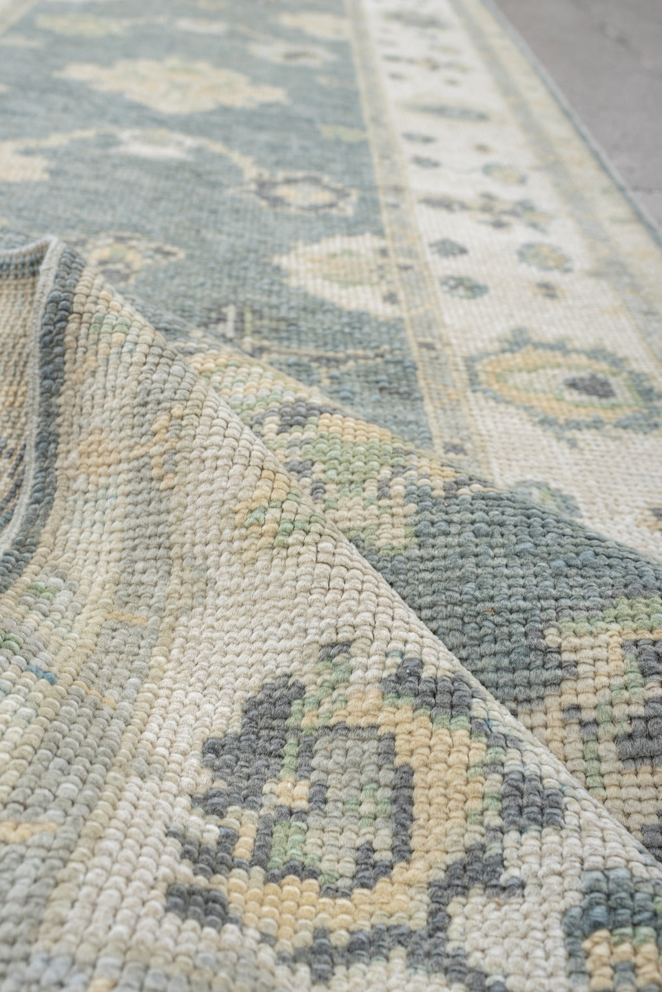 3' x 9' one-of-a-kind handmade vintage Oushak runner rug. Color palette: pale blue, ivory, sage, taupe, slate, cream