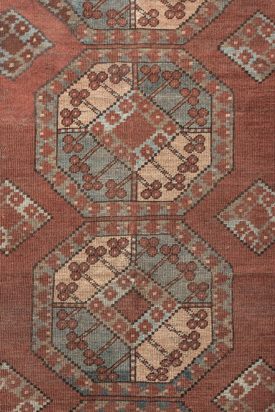 7' x 9' one-of-a-kind handmade vintage Afghan rug. Color palette: terracotta, ivory, blue gray, rust, taupe, camel, brown