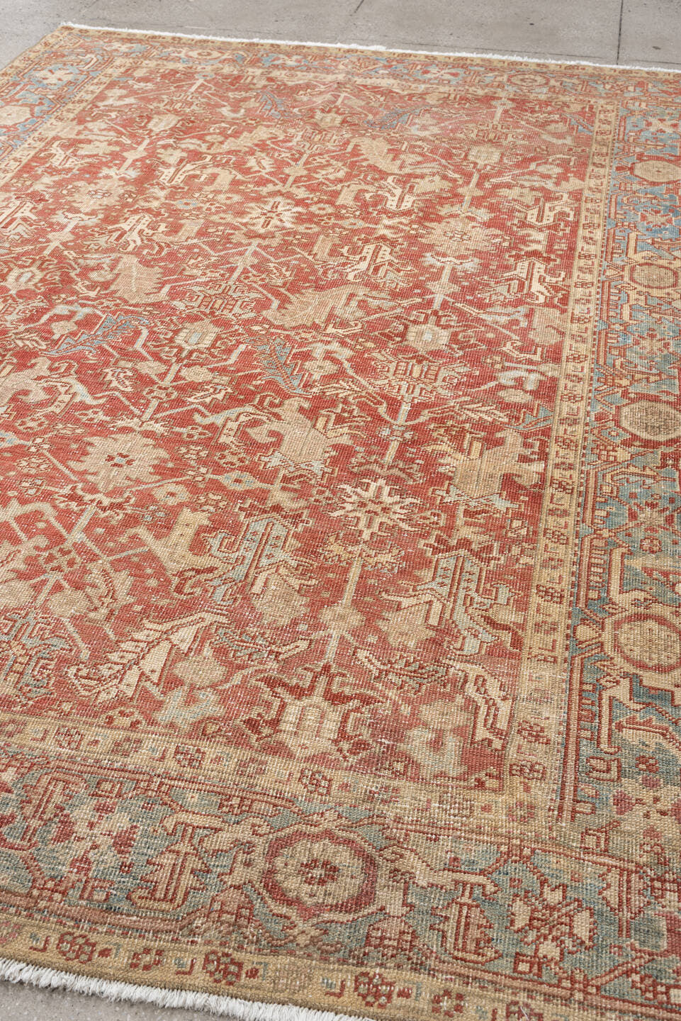 7' x 9' one-of-a-kind handmade vintage Heriz large size rug. Color palette: terracotta, ivory, sky blue, camel, rust, taupe