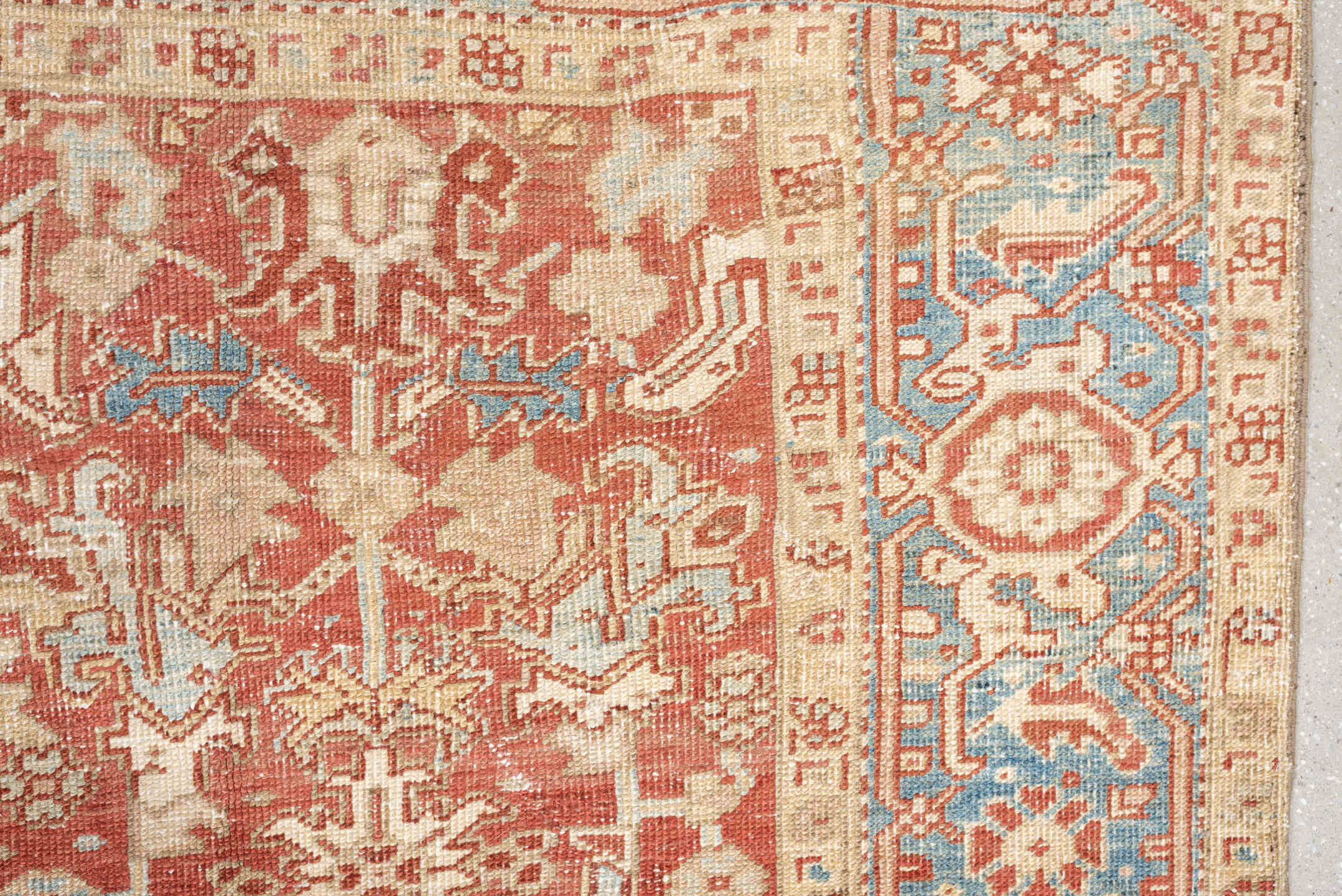 7' x 9' one-of-a-kind handmade vintage Heriz large size rug. Color palette: terracotta, ivory, sky blue, camel, rust, taupe