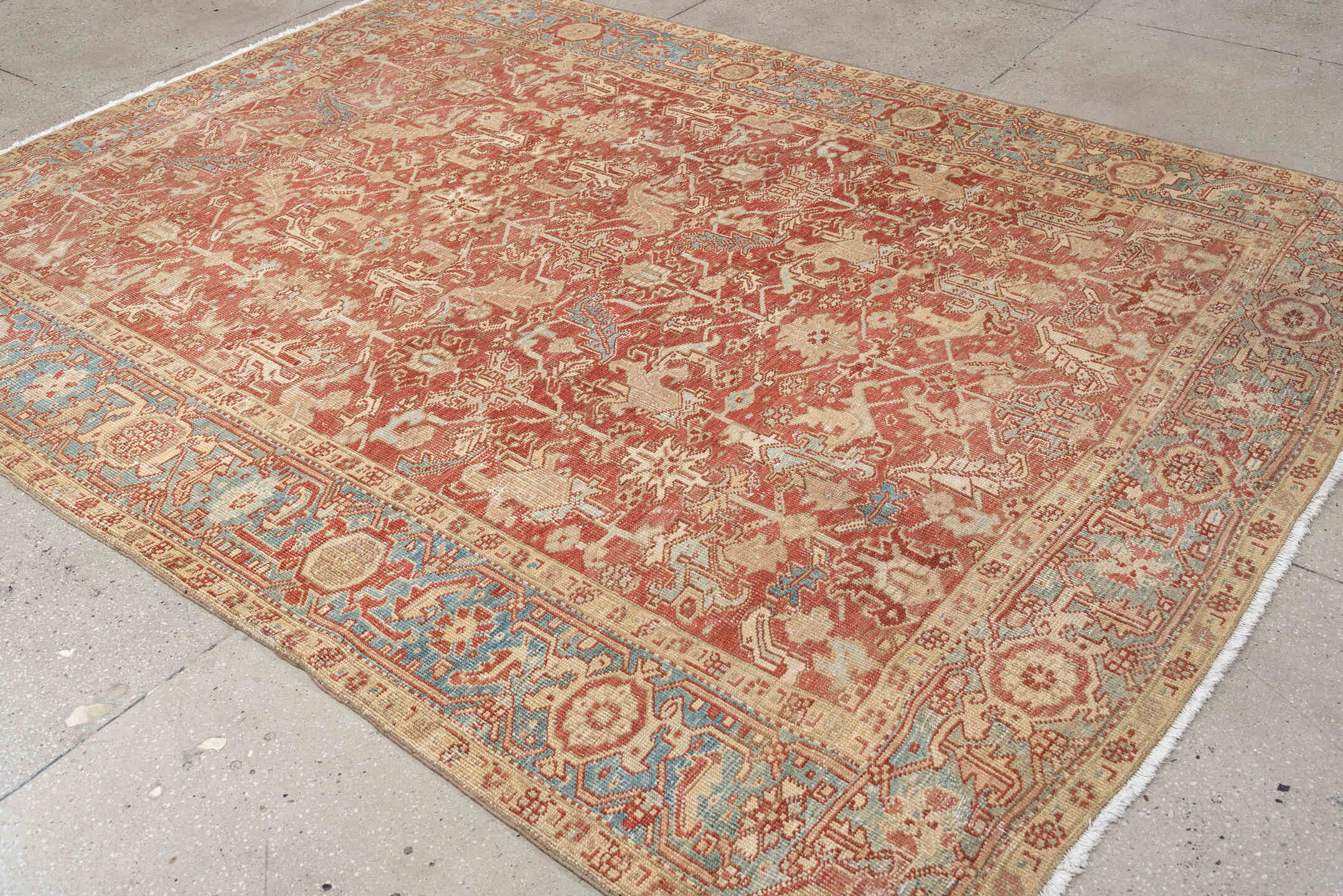 7' x 9' one-of-a-kind handmade vintage Heriz large size rug. Color palette: terracotta, ivory, sky blue, camel, rust, taupe