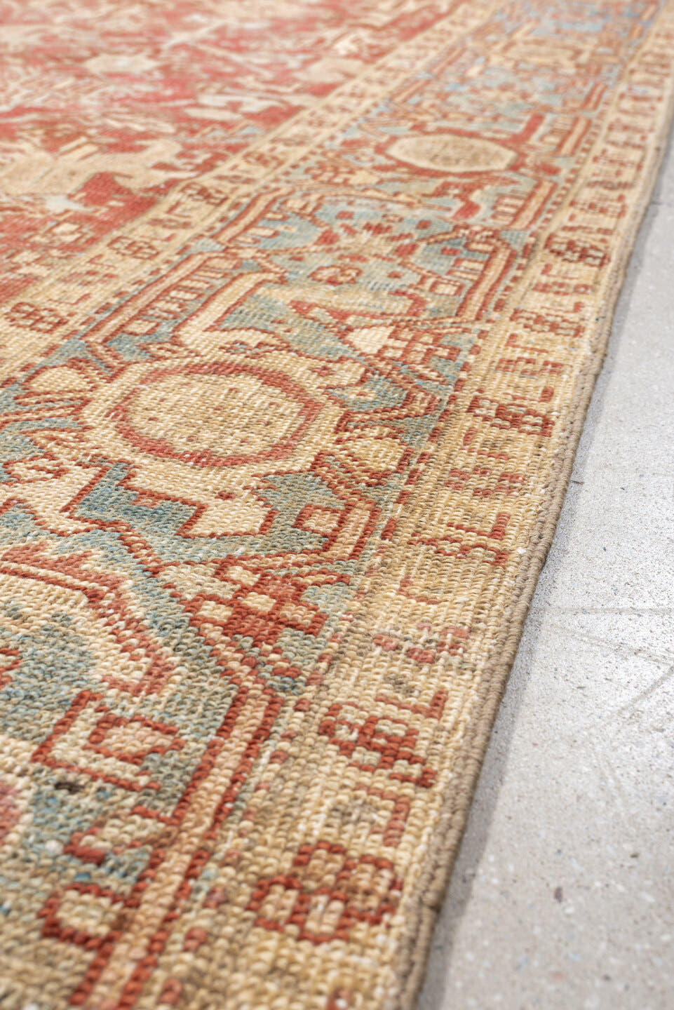 7' x 9' one-of-a-kind handmade vintage Heriz large size rug. Color palette: terracotta, ivory, sky blue, camel, rust, taupe
