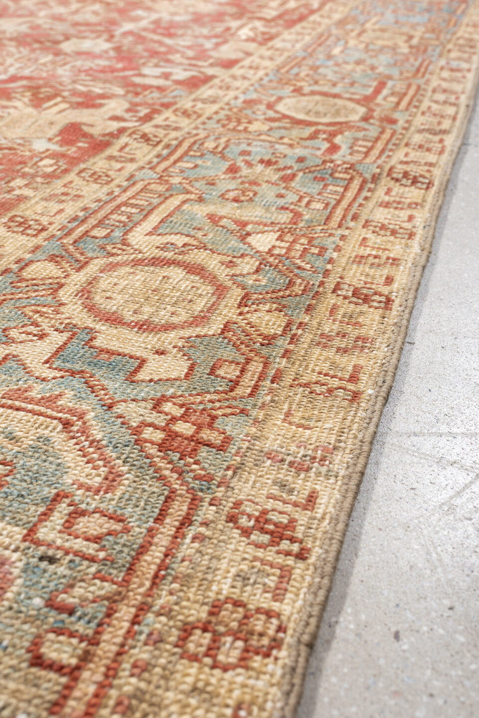 7' x 9' one-of-a-kind handmade vintage Heriz large size rug. Color palette: terracotta, ivory, sky blue, camel, rust, taupe