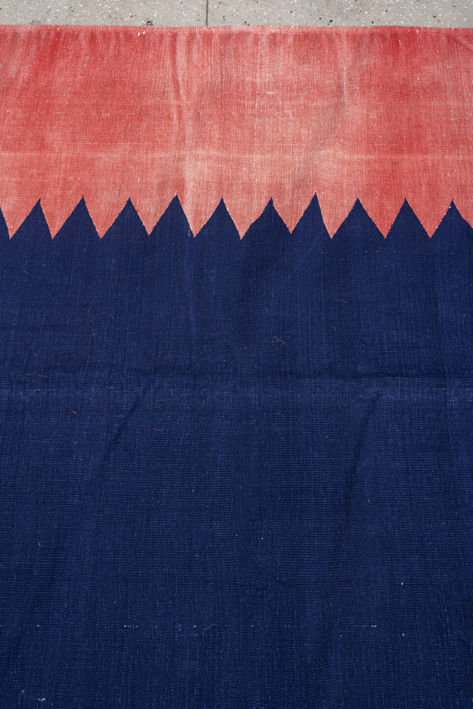 9' x 15' one-of-a-kind handmade antique Cot Dhurrie rug. Color palette: indigo, coral, rose, navy, ivory, purple, terracotta