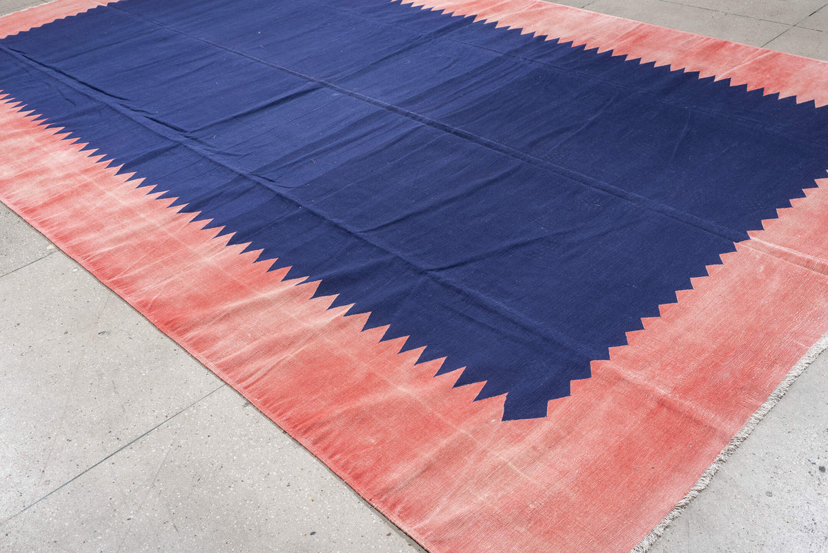 9' x 15' one-of-a-kind handmade antique Cot Dhurrie rug. Color palette: indigo, coral, rose, navy, ivory, purple, terracotta