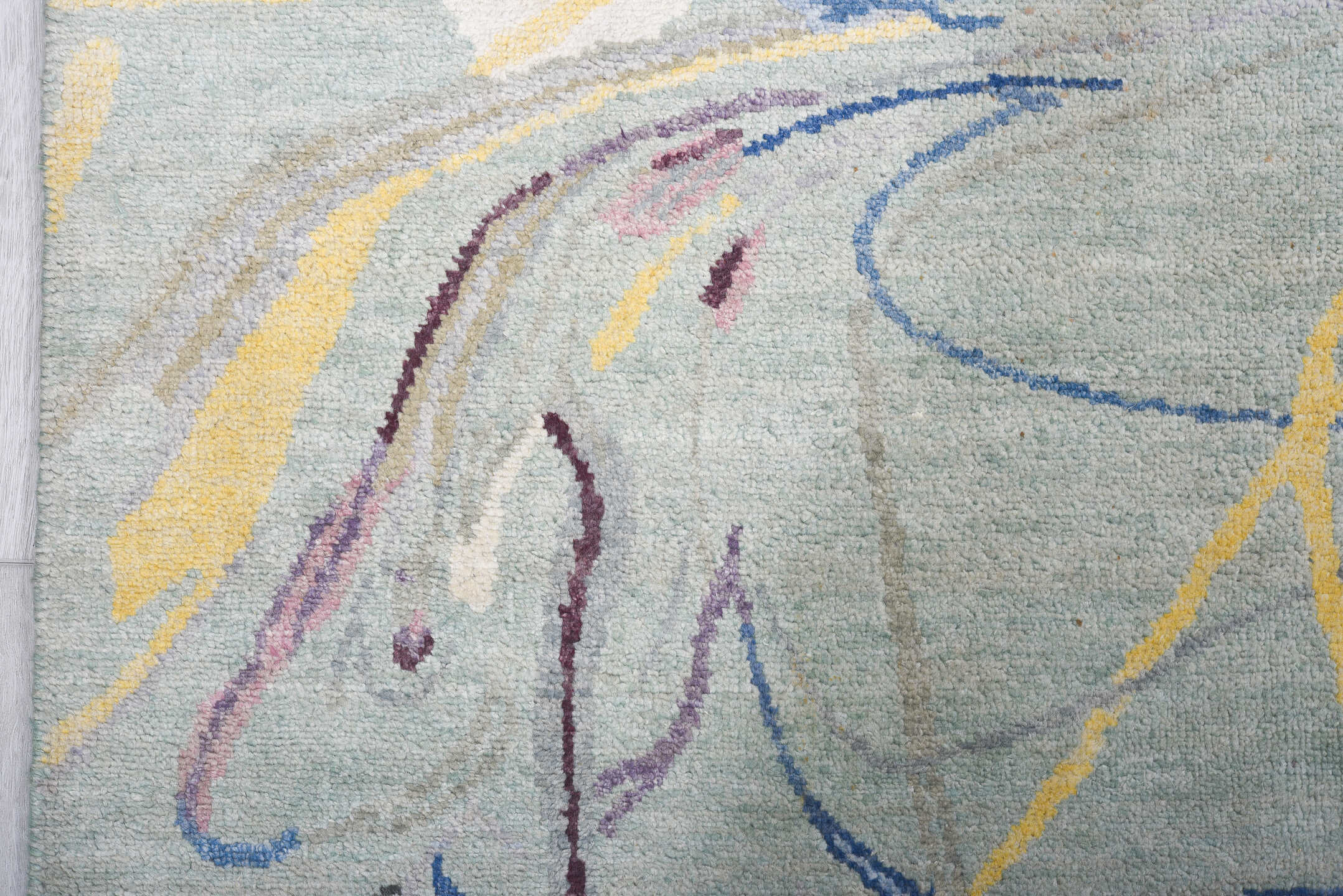 6' x 9' one-of-a-kind handmade handmade Contemporary medium size rug. Color palette: aqua, ivory, blue, plum, pink