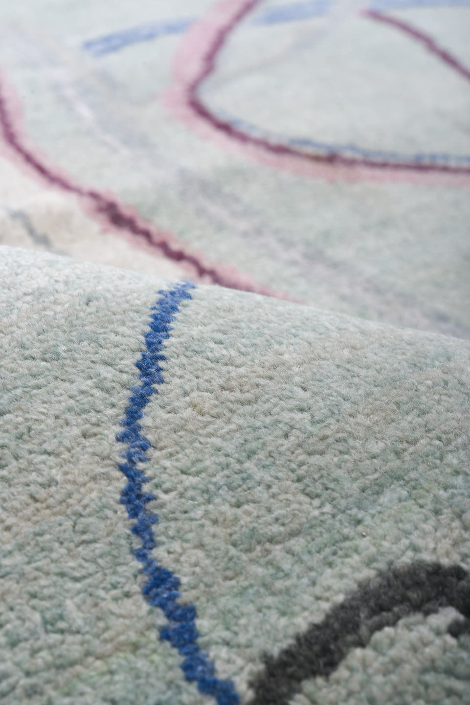 6' x 9' one-of-a-kind handmade handmade Contemporary medium size rug. Color palette: aqua, ivory, blue, plum, pink