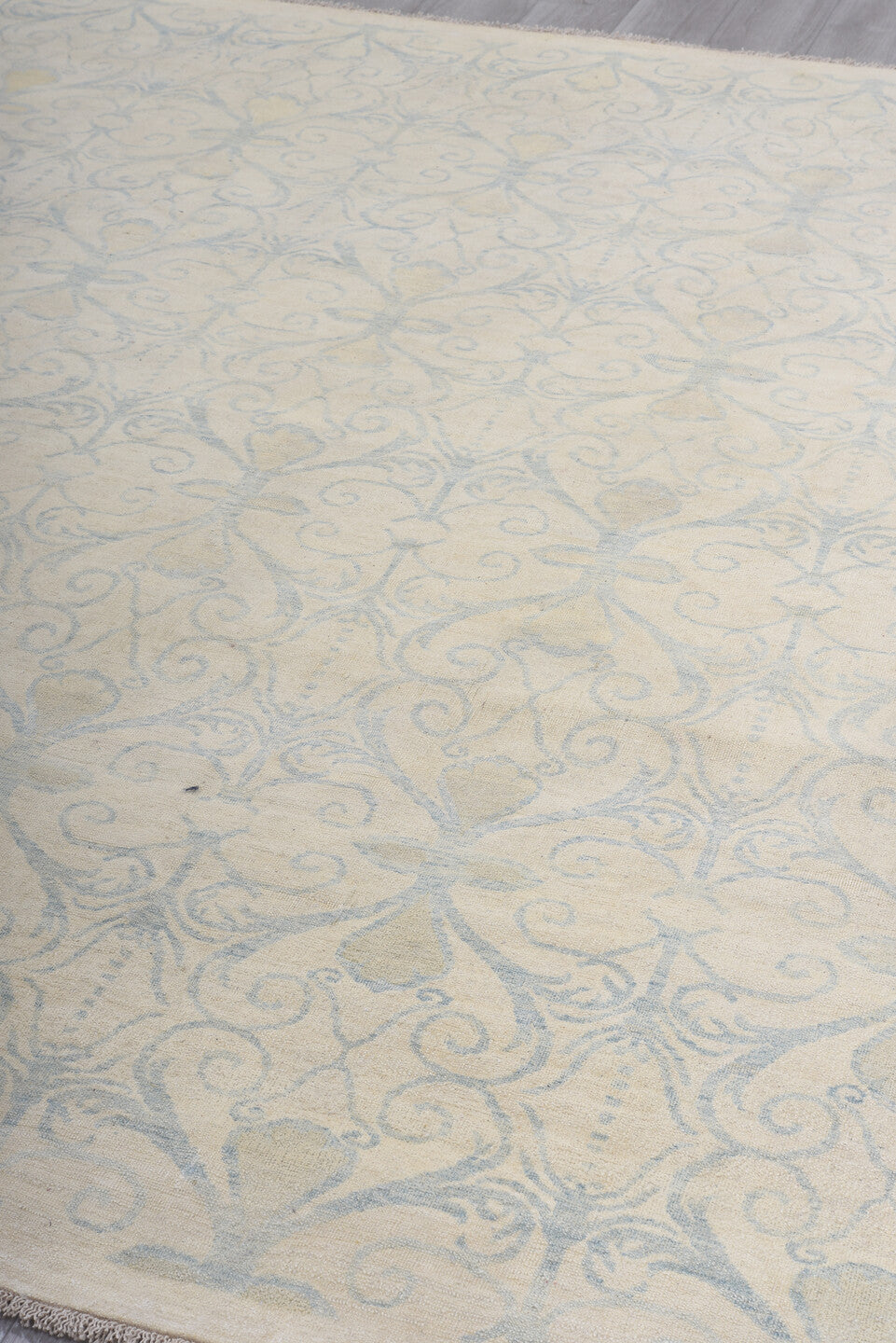 8' x 9' one-of-a-kind handmade vintage European rug. Color palette: ivory, pale blue, cream, beige, light blue