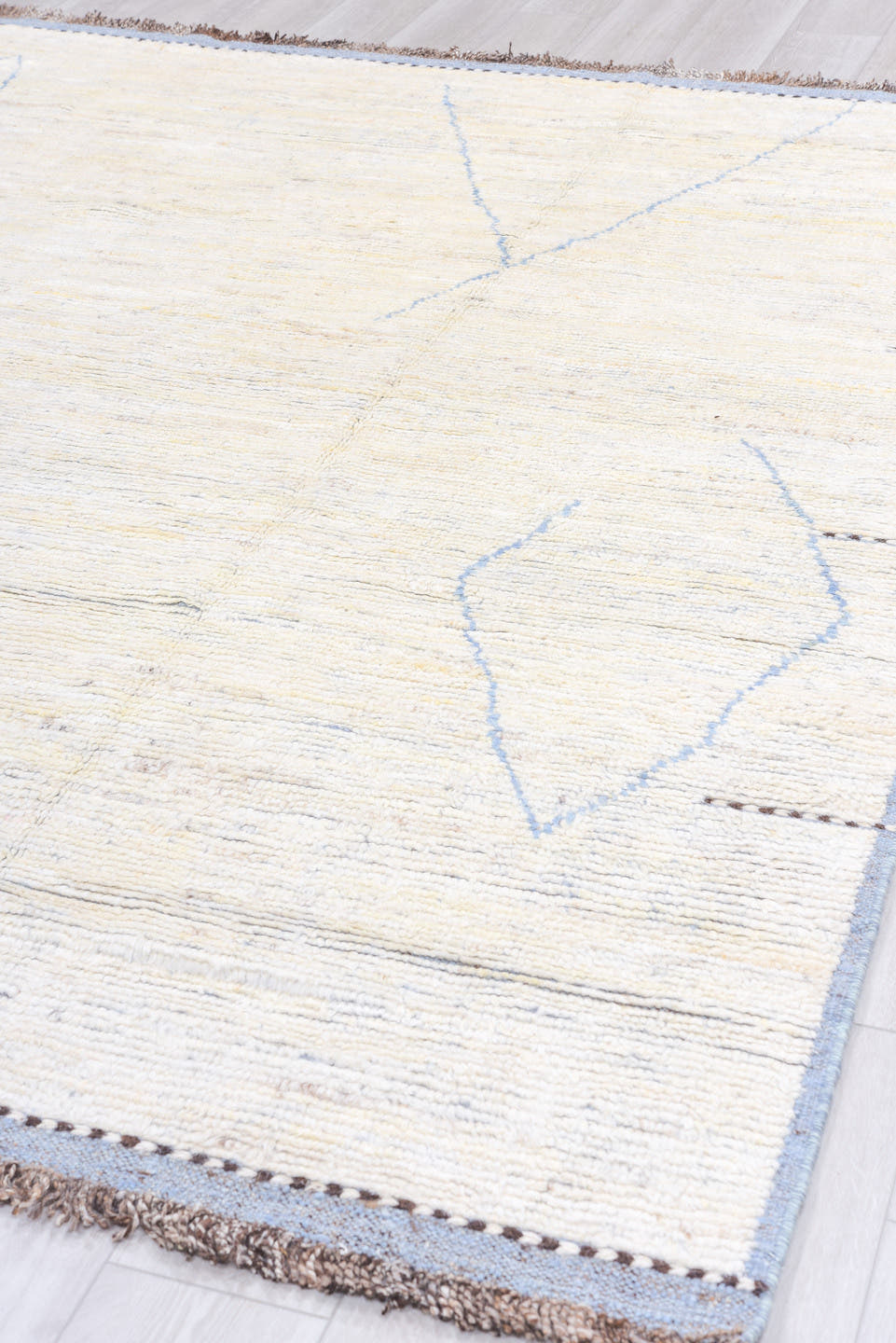 8' x 9' one-of-a-kind handmade vintage  rug. Color palette: ivory, pale blue, taupe, brown, charcoal, light blue, beige