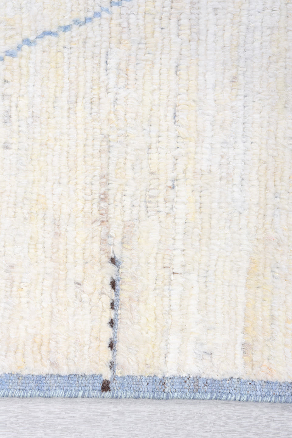 8' x 9' one-of-a-kind handmade vintage  rug. Color palette: ivory, pale blue, taupe, brown, charcoal, light blue, beige