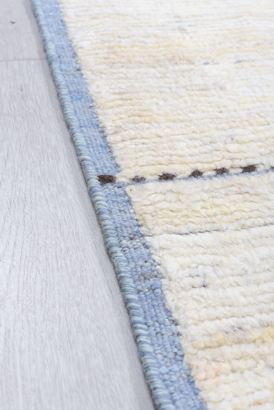 8' x 9' one-of-a-kind handmade vintage  rug. Color palette: ivory, pale blue, taupe, brown, charcoal, light blue, beige