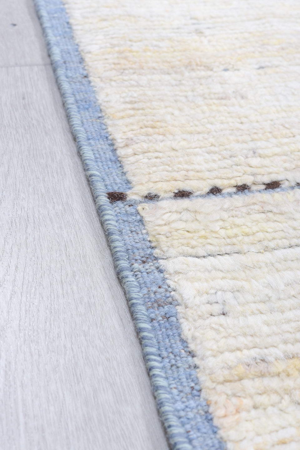 8' x 9' one-of-a-kind handmade vintage  rug. Color palette: ivory, pale blue, taupe, brown, charcoal, light blue, beige