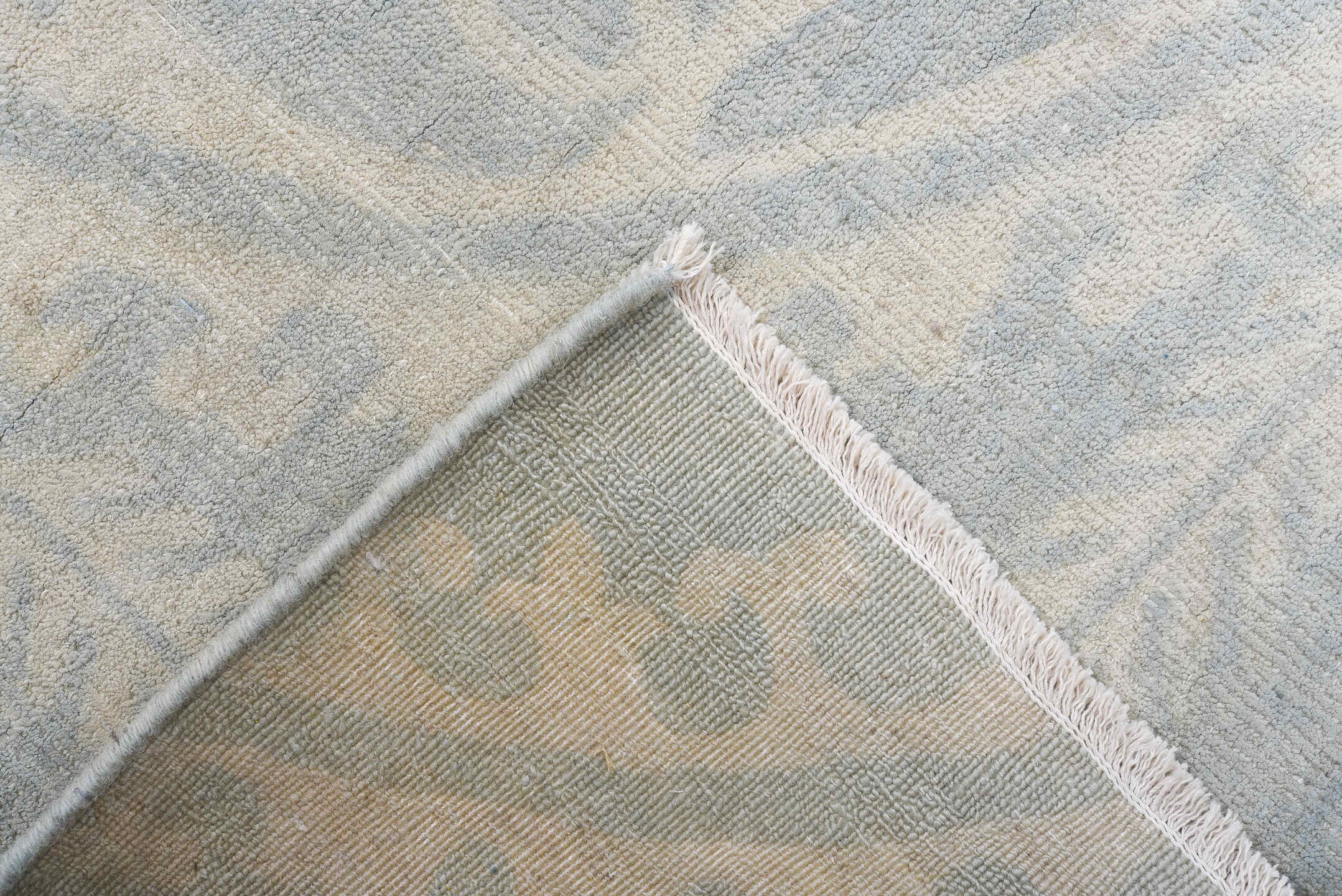 7' x 9' one-of-a-kind handmade vintage European rug. Color palette: pale blue, ivory, cream, silver, taupe, light blue, gray