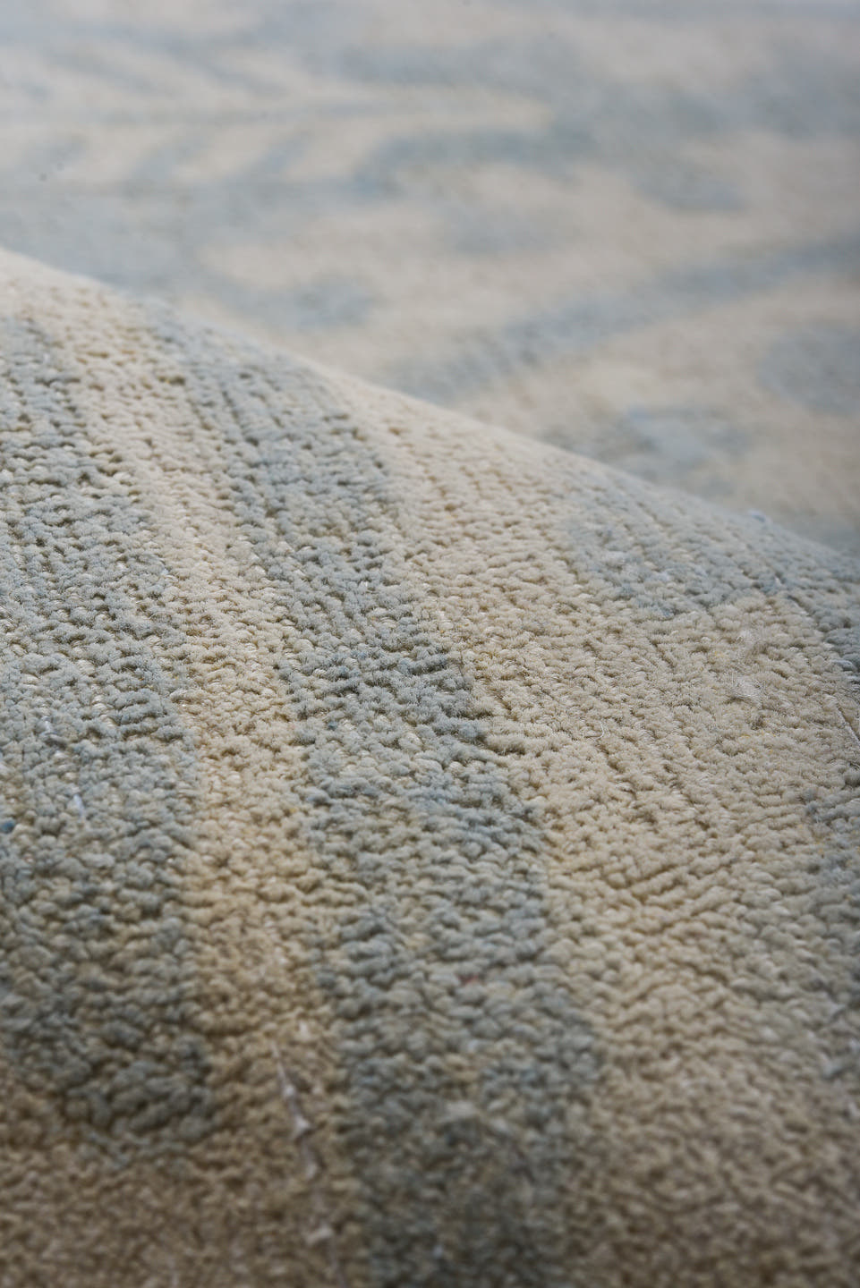 7' x 9' one-of-a-kind handmade vintage European rug. Color palette: pale blue, ivory, cream, silver, taupe, light blue, gray