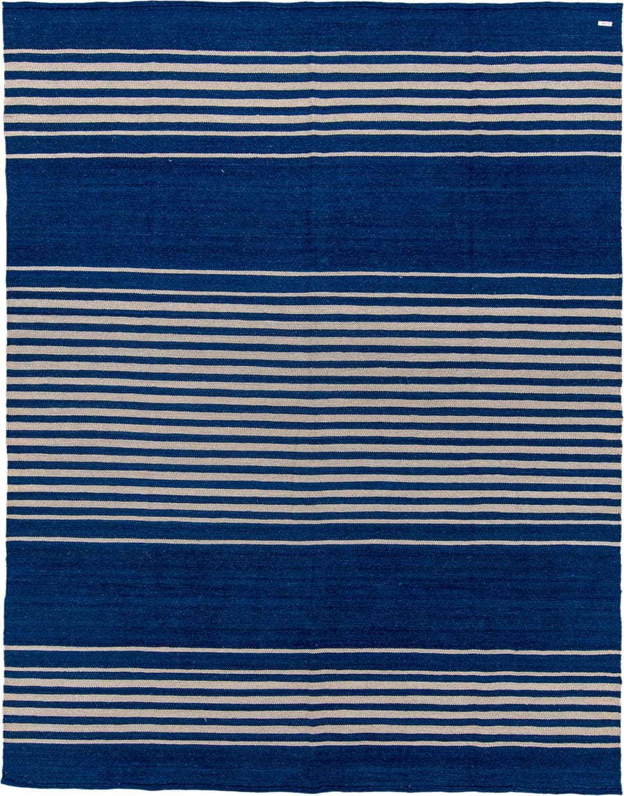 7' x 9' one-of-a-kind handmade vintage Kilim rug. Color palette: indigo, ivory, purple