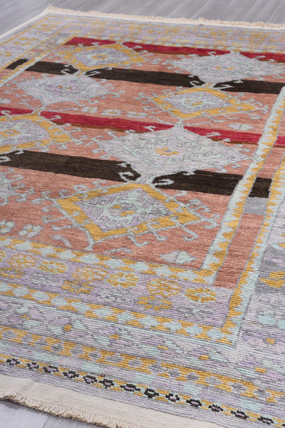 8' x 12' one-of-a-kind handmade vintage Tulu large size rug. Color palette: peach, lavender, ivory, gold, crimson, charcoal