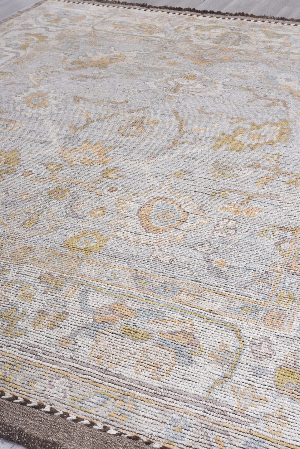 9' x 12' one-of-a-kind handmade vintage Tulu large size rug. Color palette: ivory, light gray, gold, blush, pale blue, taupe