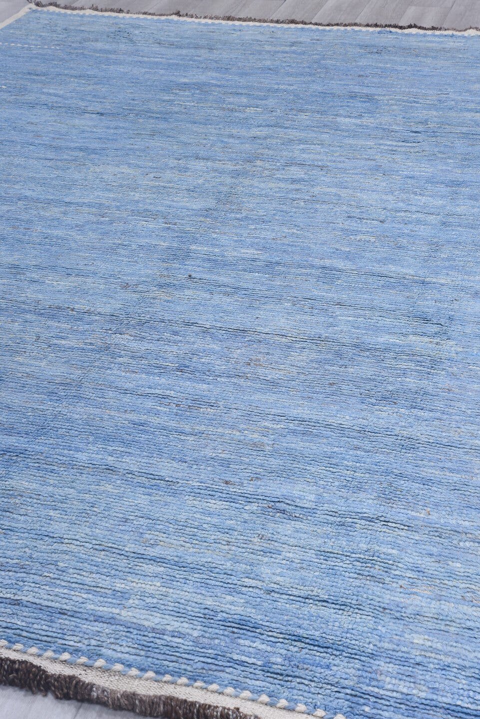 9' x 12' one-of-a-kind handmade vintage Tulu large size rug. Color palette: sky blue, ivory, slate, taupe, light blue, gray