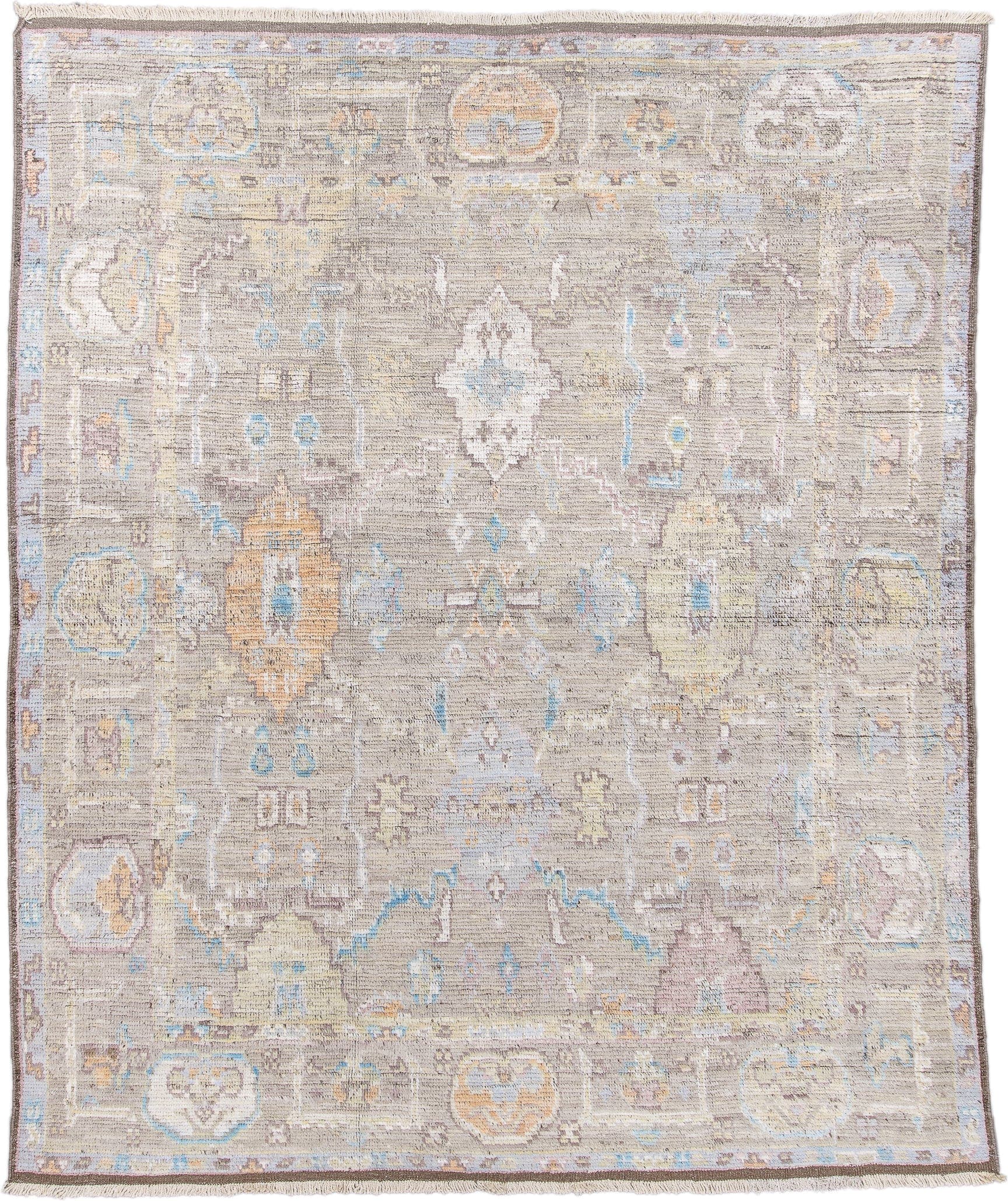 8' x 9' one-of-a-kind handmade vintage Tulu rug. Color palette: taupe, ivory, pale blue, beige, gold, blush, gray, camel