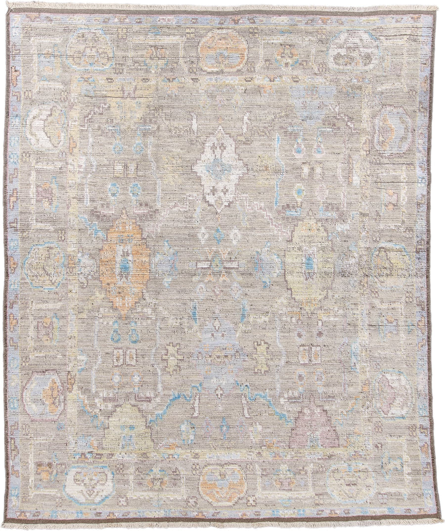 8' x 9' one-of-a-kind handmade vintage Tulu rug. Color palette: taupe, ivory, pale blue, beige, gold, blush, gray, camel