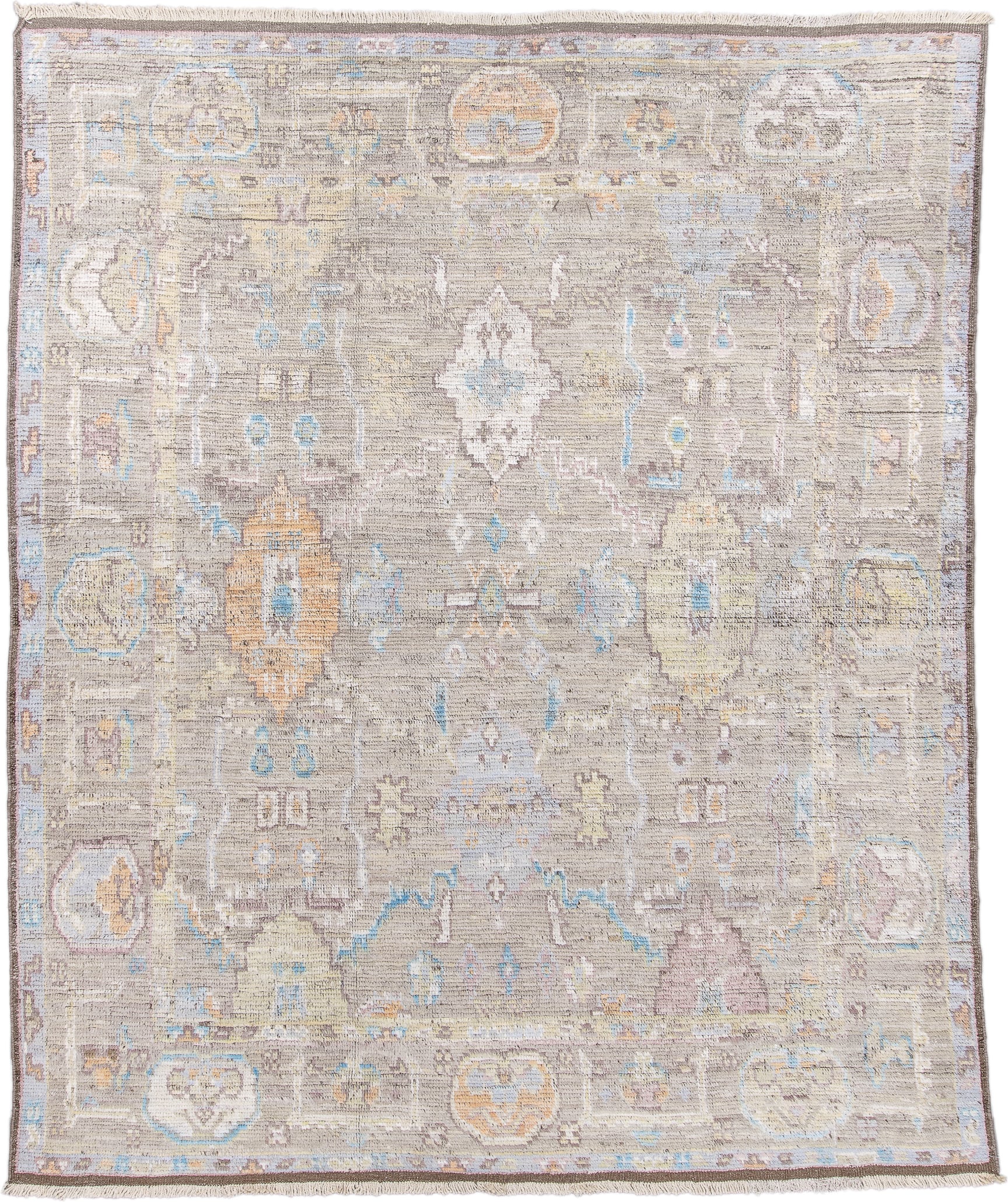 8' x 9' one-of-a-kind handmade vintage Tulu rug. Color palette: taupe, ivory, pale blue, beige, gold, blush, gray, camel