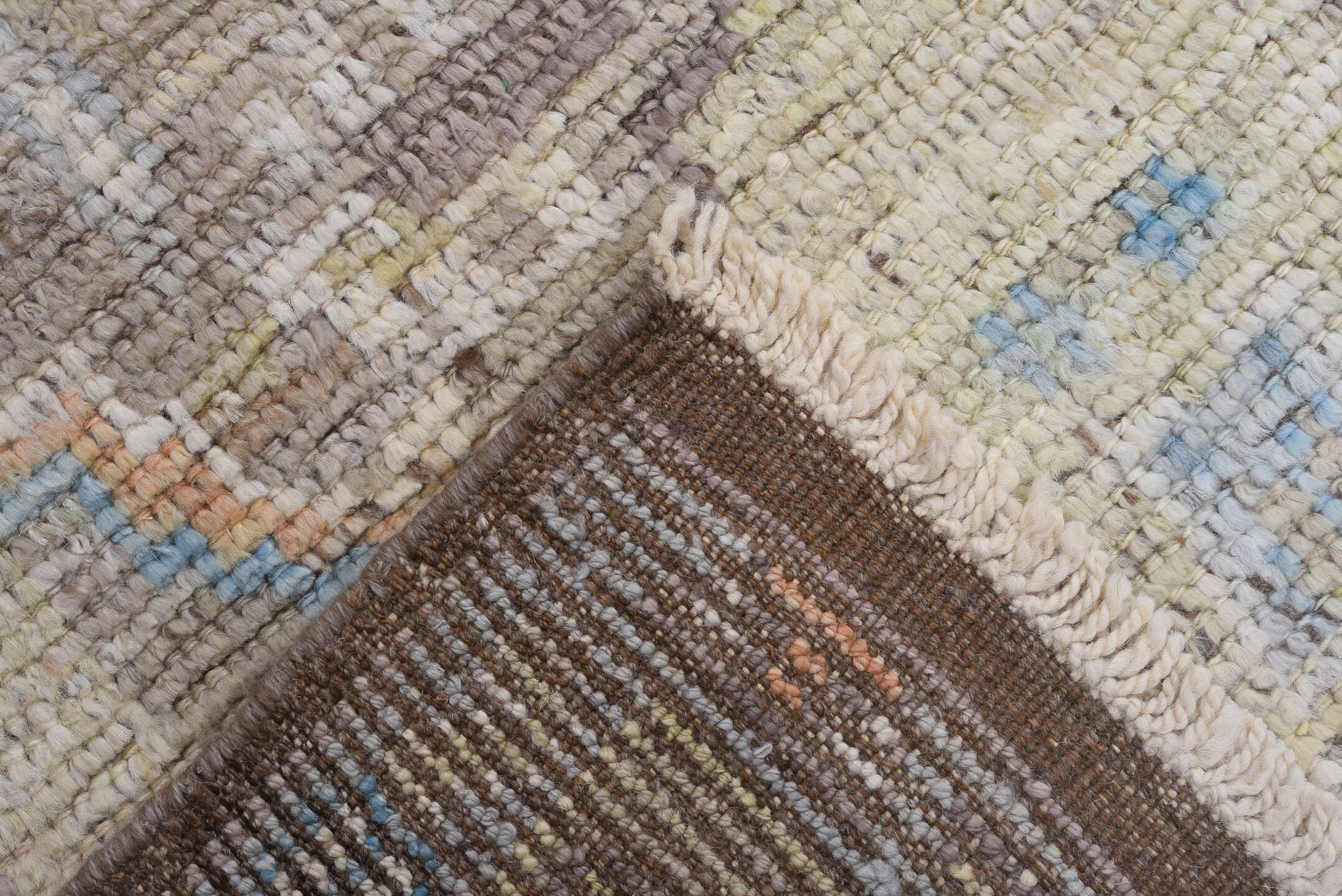 8' x 9' one-of-a-kind handmade vintage Tulu rug. Color palette: taupe, ivory, pale blue, beige, gold, blush, gray, camel