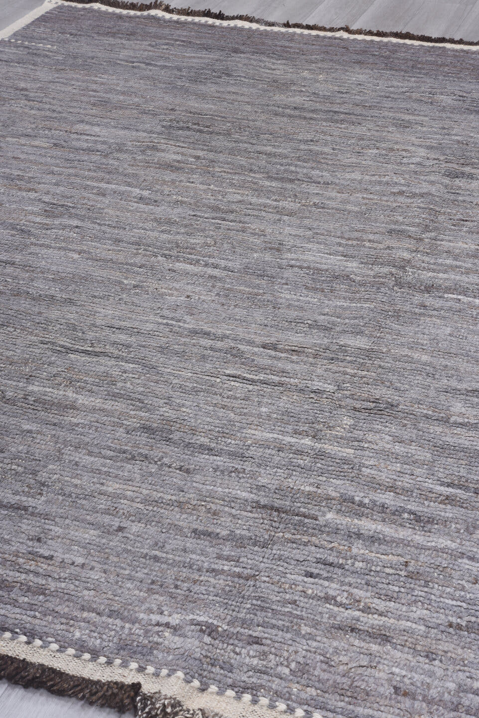 8' x 9' one-of-a-kind handmade vintage Tulu rug. Color palette: gray, ivory, taupe, charcoal, brown, beige, black