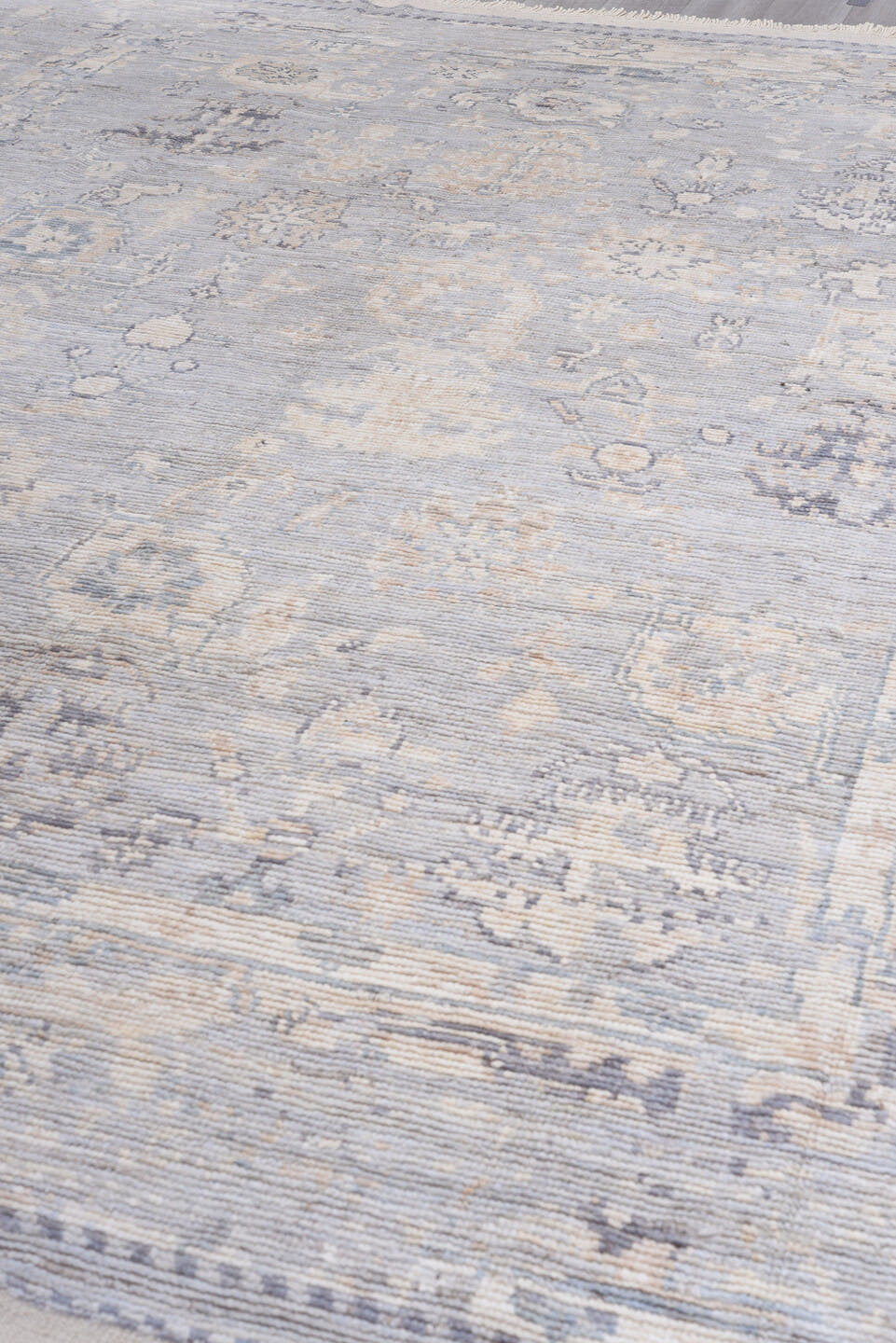 9' x 13' one-of-a-kind handmade vintage Tulu large size rug. Color palette: ivory, pale blue, lavender, cream, taupe