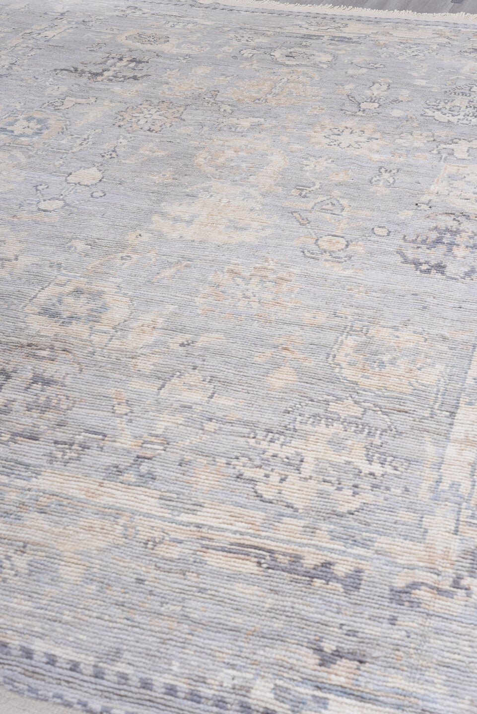 9' x 13' one-of-a-kind handmade vintage Tulu large size rug. Color palette: ivory, pale blue, lavender, cream, taupe