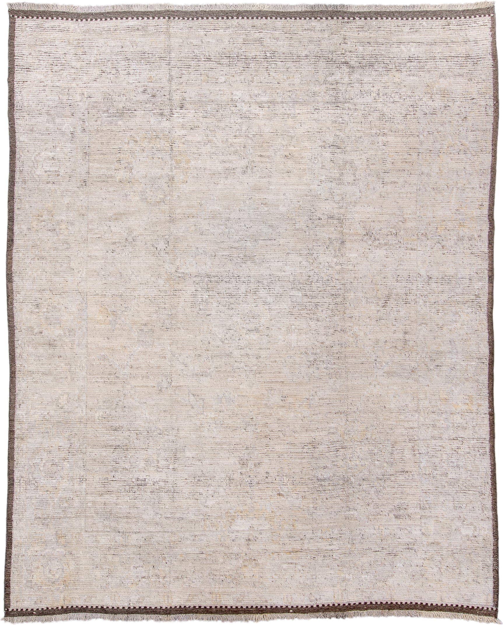 8' x 10' one-of-a-kind handmade vintage Tulu large size rug. Color palette: ivory, taupe, brown, camel, gray, beige