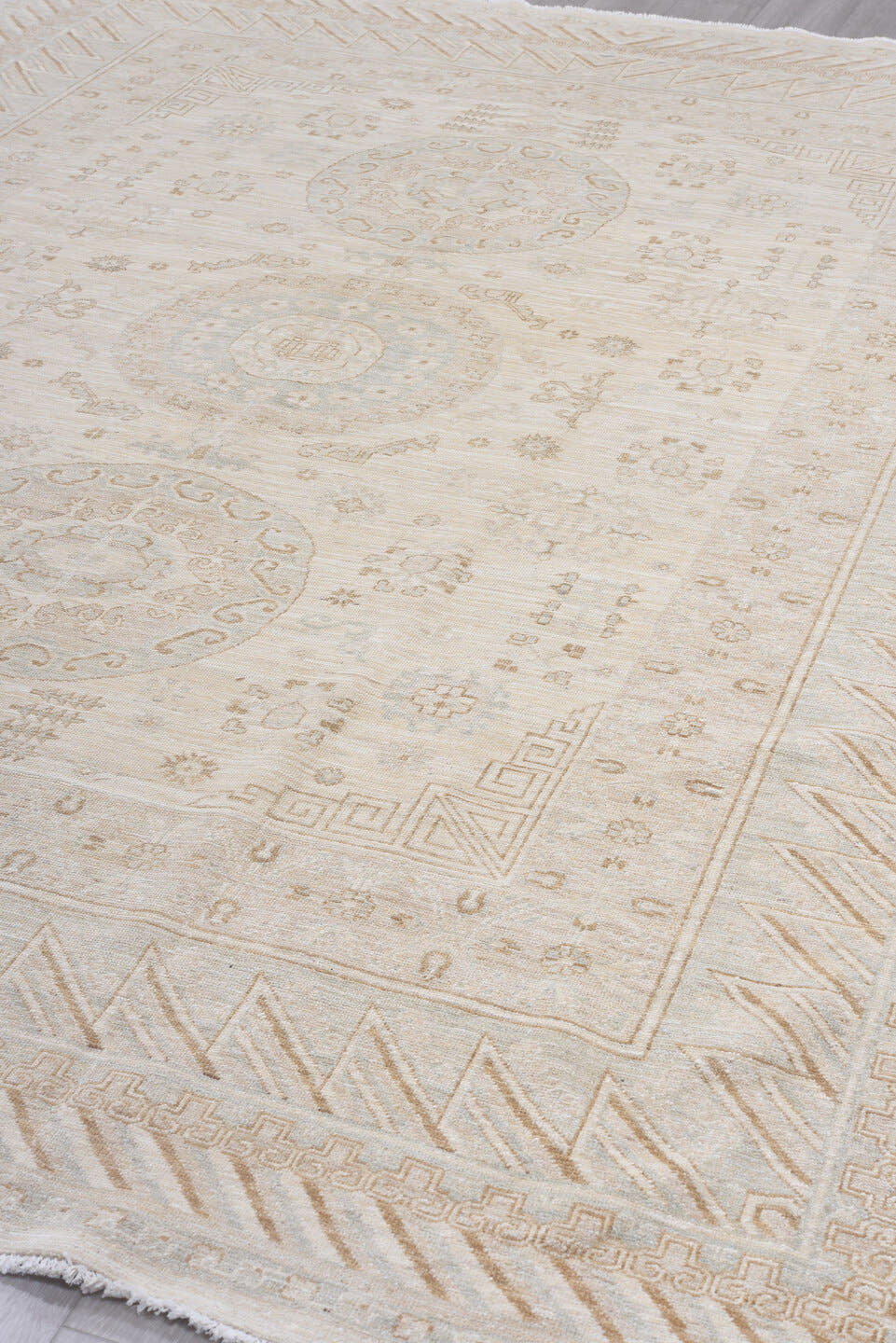 8' x 11' one-of-a-kind handmade vintage Khotan large size rug. Color palette: ivory, cream, beige, taupe, camel, pale gold