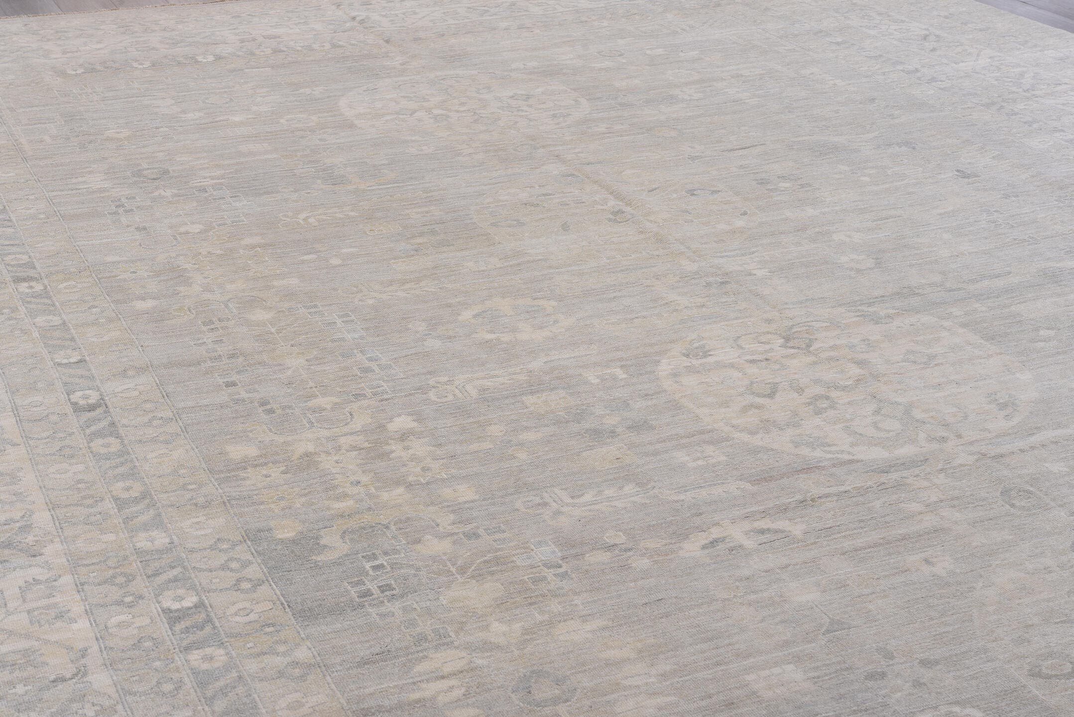 13' x 19' one-of-a-kind handmade vintage Khotan oversize rug. Color palette: ivory, taupe, beige, pale gray, sand, gray
