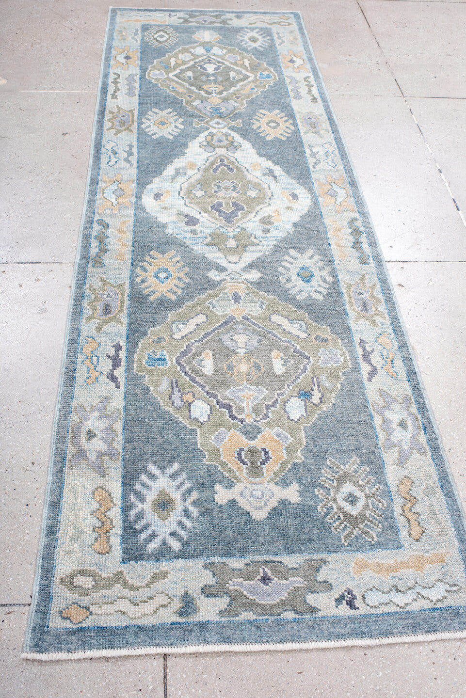 2' x 9' one-of-a-kind handmade vintage Oushak runner rug. Color palette: blue, ivory, sage, taupe, pale_gold, slate, green