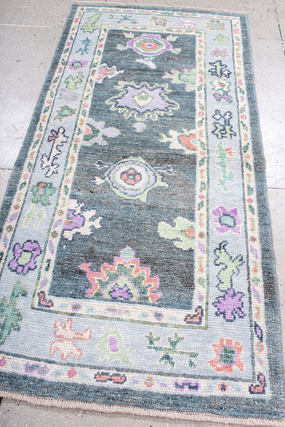 3' x 6' one-of-a-kind handmade vintage Oushak runner rug. Color palette: charcoal, ivory, lavender, sage, soft blue, coral