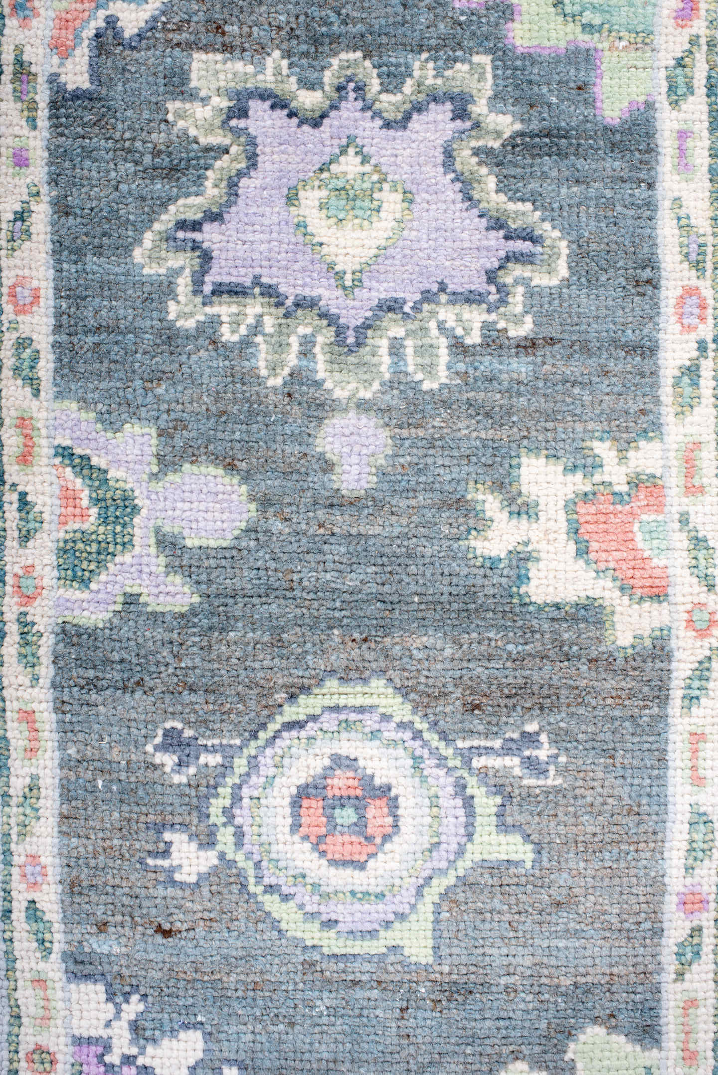 3' x 6' one-of-a-kind handmade vintage Oushak runner rug. Color palette: charcoal, ivory, lavender, sage, soft blue, coral